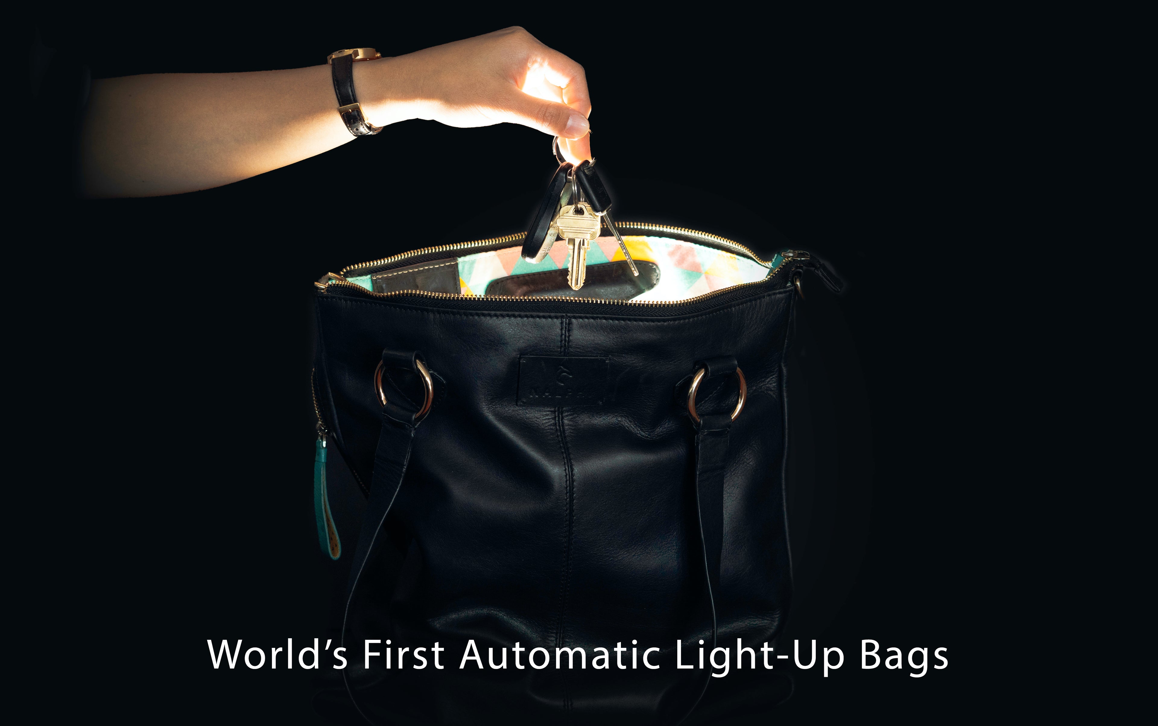 Load video: Video showing features of NALPHI Auto Illuminating Luxury Leather Smart Tote Bag